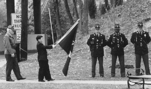 POW/MIA flag being placed at monument